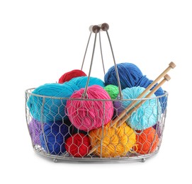 Photo of Metal basket with bright yarns and knitting needles isolated on white