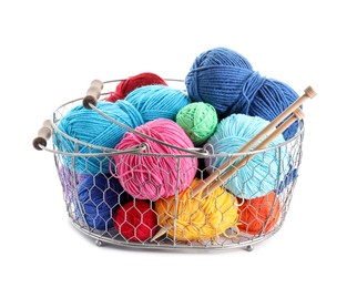 Photo of Metal basket with bright yarns and knitting needles isolated on white