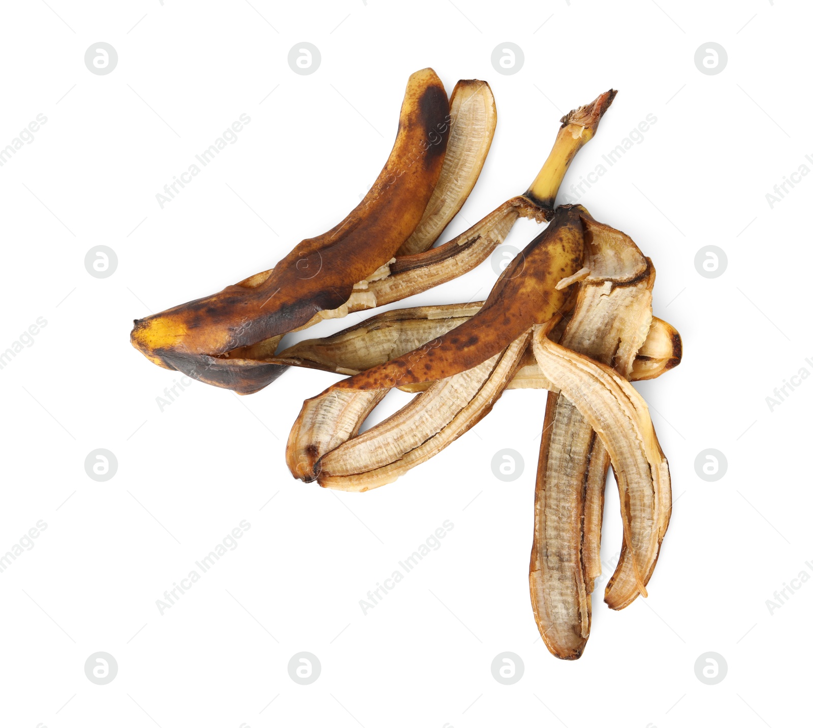 Photo of Banana peels with dark spots isolated on white, top view