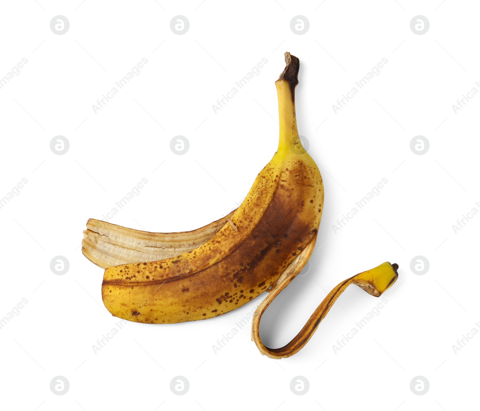 Photo of Banana peel with dark spots isolated on white, top view