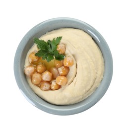 Delicious hummus with olive oil, chickpeas and parsley isolated on white, top view