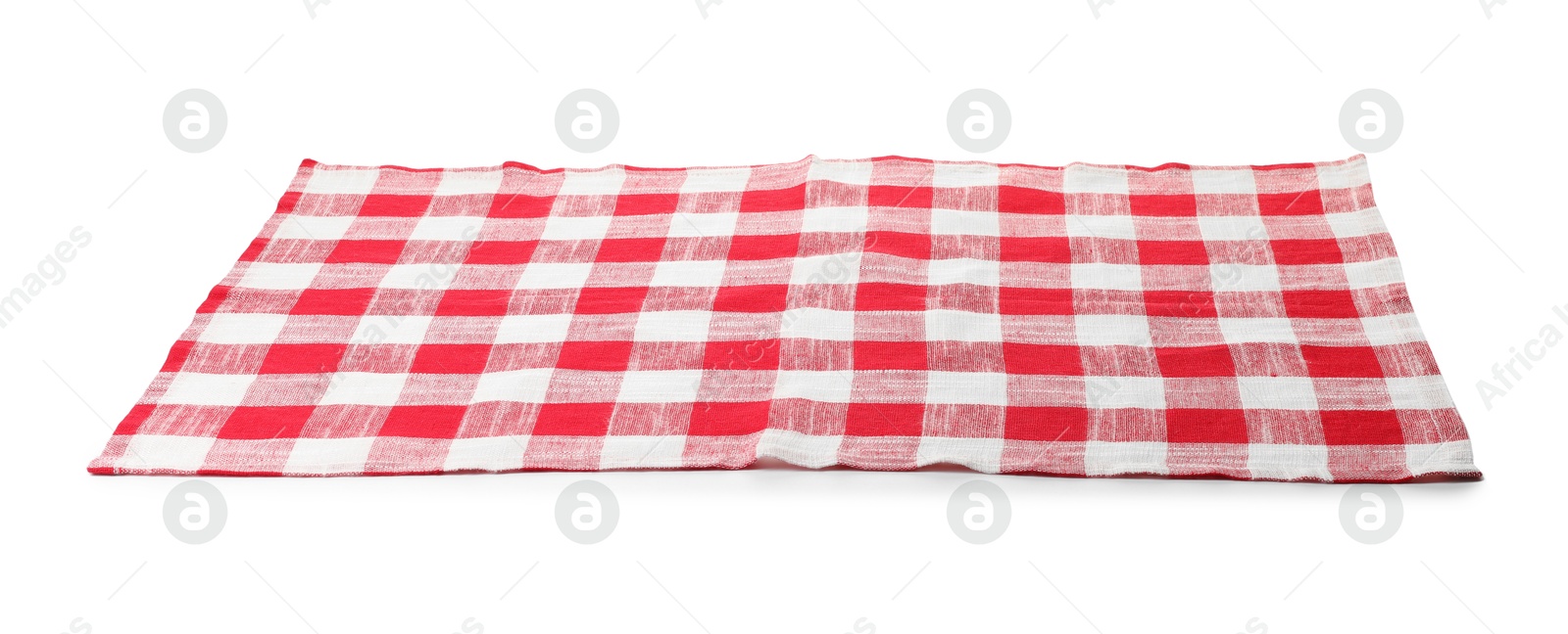 Photo of Folded tablecloth with checkered pattern isolated on white