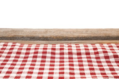 Photo of Tablecloth with checkered pattern on wooden table against white background