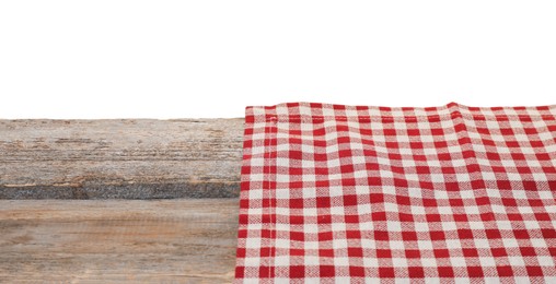 Tablecloth with checkered pattern on wooden table against white background