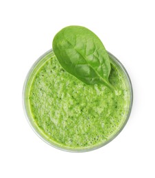 Photo of Tasty green smoothie and spinach leaf in glass isolated on white, top view