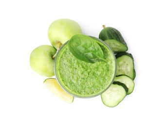 Photo of Tasty green smoothie in glass, lime, apples and cucumber isolated on white, top view