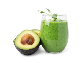 Photo of Tasty green smoothie in glass and avocado isolated on white