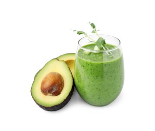 Photo of Tasty green smoothie in glass and avocado isolated on white