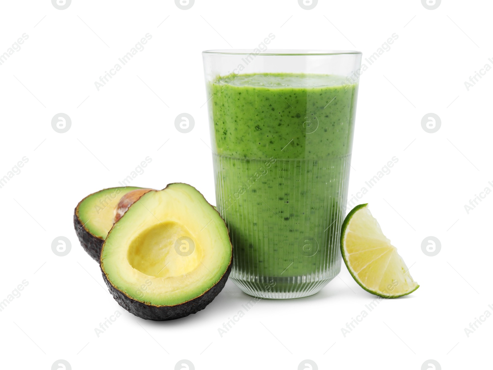 Photo of Tasty green smoothie in glass, avocado and lime isolated on white