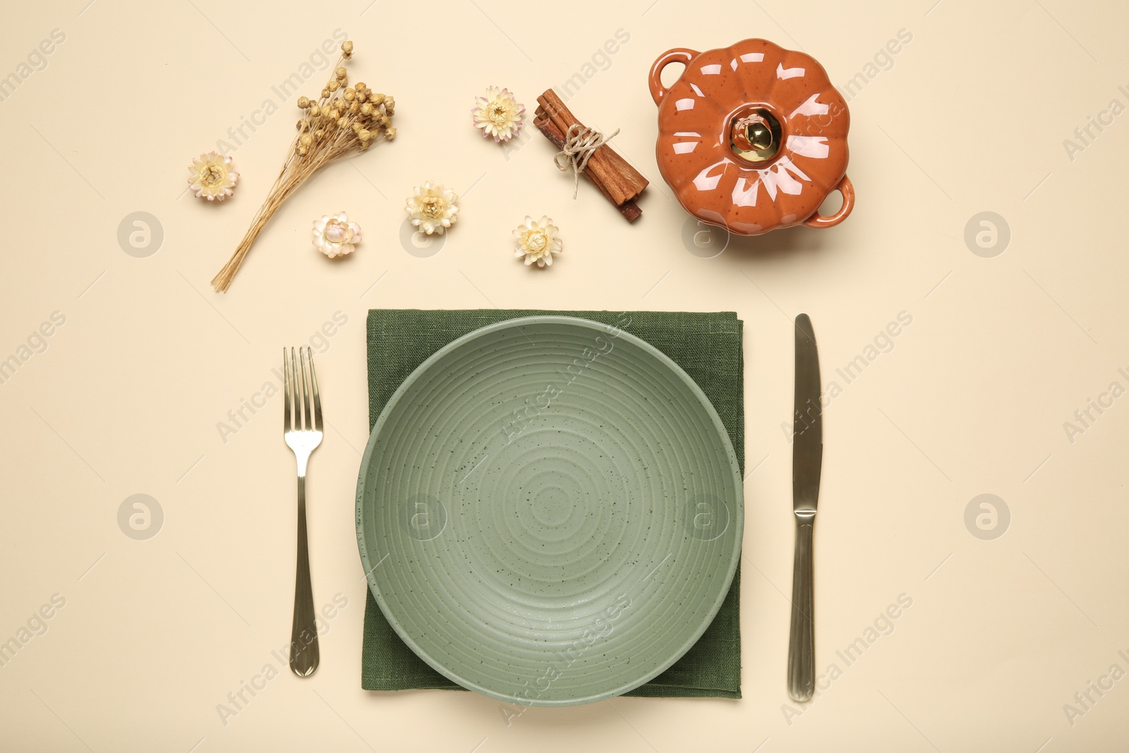 Photo of Beautiful table setting with autumn decor on beige background, flat lay