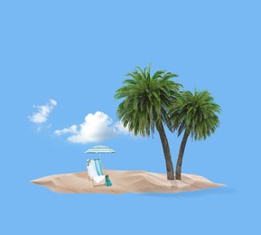 Image of Summer travel to tropical island. Sand with palm trees, beach umbrella and deckchair. Light blue background as sky and sea