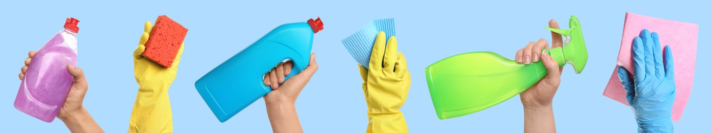 Image of Janitors holding different cleaning supplies on light blue background, closeup