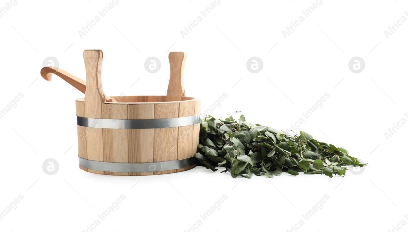 Photo of Sauna equipment. Wooden bucket with ladle and birch whisk isolated on white