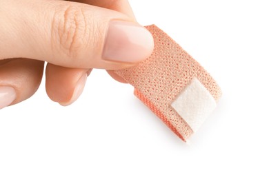 Photo of Woman putting medical adhesive bandage on white background, closeup