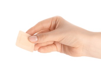 Photo of Woman holding medical adhesive bandage on white background, closeup
