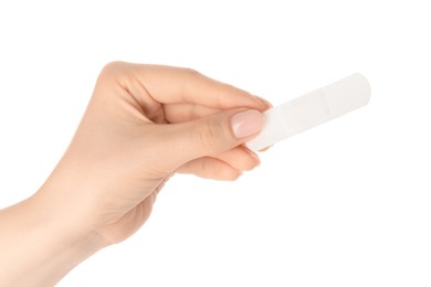 Photo of Woman holding medical adhesive bandage on white background, closeup