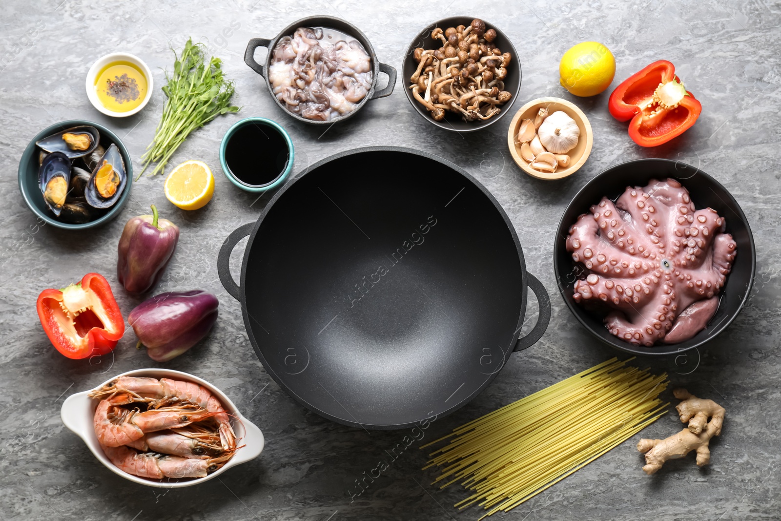 Photo of Ingredients for wok on grey table, flat lay