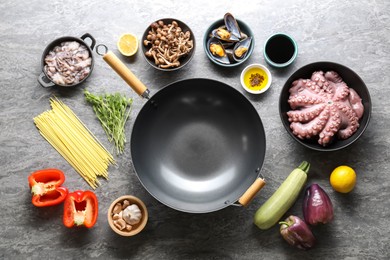 Photo of Ingredients for wok on grey table, flat lay