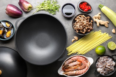 Photo of Ingredients for wok on grey table, flat lay