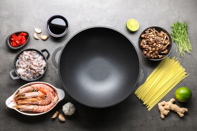 Photo of Ingredients for wok on grey table, flat lay