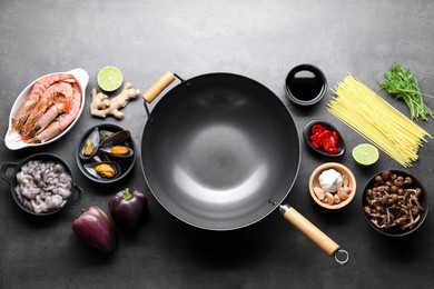 Photo of Ingredients for wok on grey table, flat lay