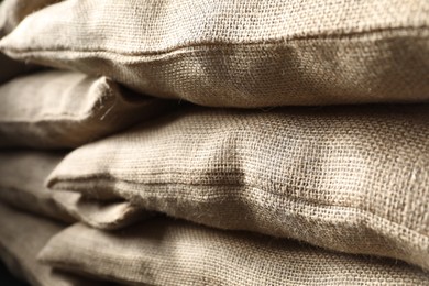 Photo of Group of burlap sacks as background, closeup