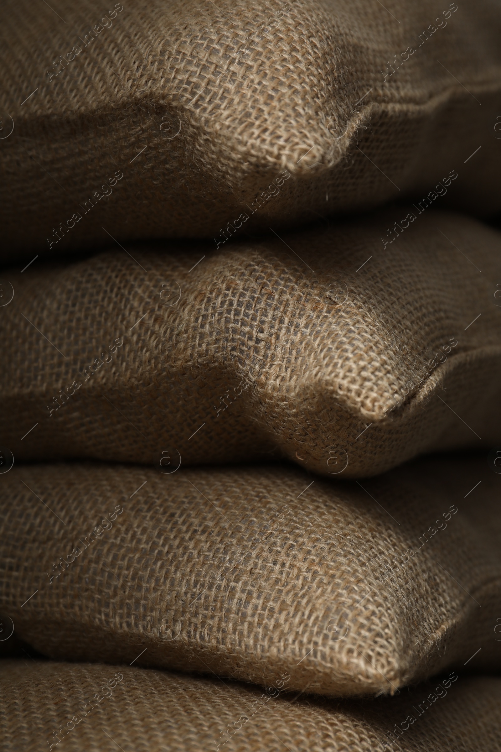 Photo of Group of burlap sacks as background, closeup