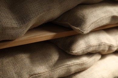 Group of burlap sacks on shelving unit, closeup