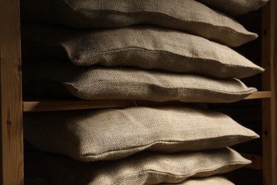 Group of burlap sacks on shelving unit