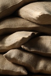 Group of burlap sacks on table, closeup