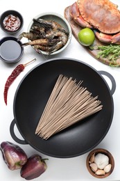 Photo of Different ingredients for wok on white table, flat lay