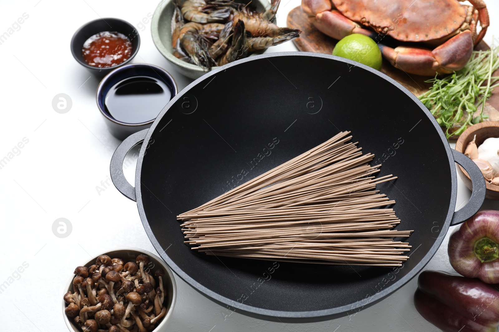 Photo of Different ingredients for wok on white table