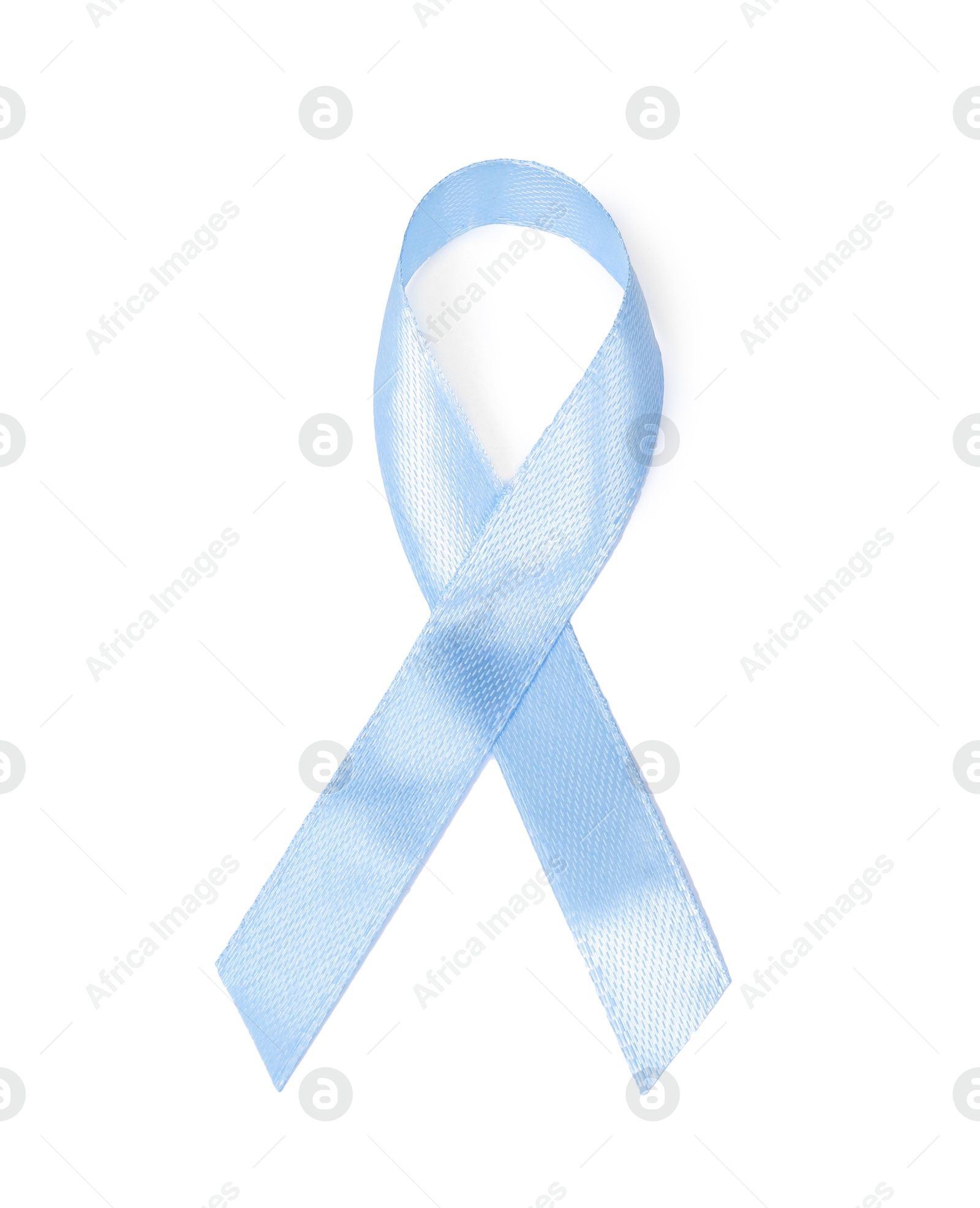 Photo of Light blue ribbon isolated on white, top view. Prostate cancer awareness