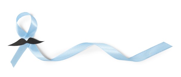 Photo of Light blue ribbon and fake mustache isolated on white, top view. Prostate cancer awareness