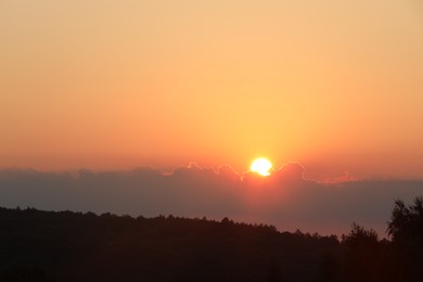 Beautiful view of sky over meadow at sunrise in morning