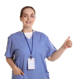 Photo of Professional nurse with badge showing thumbs up on white background