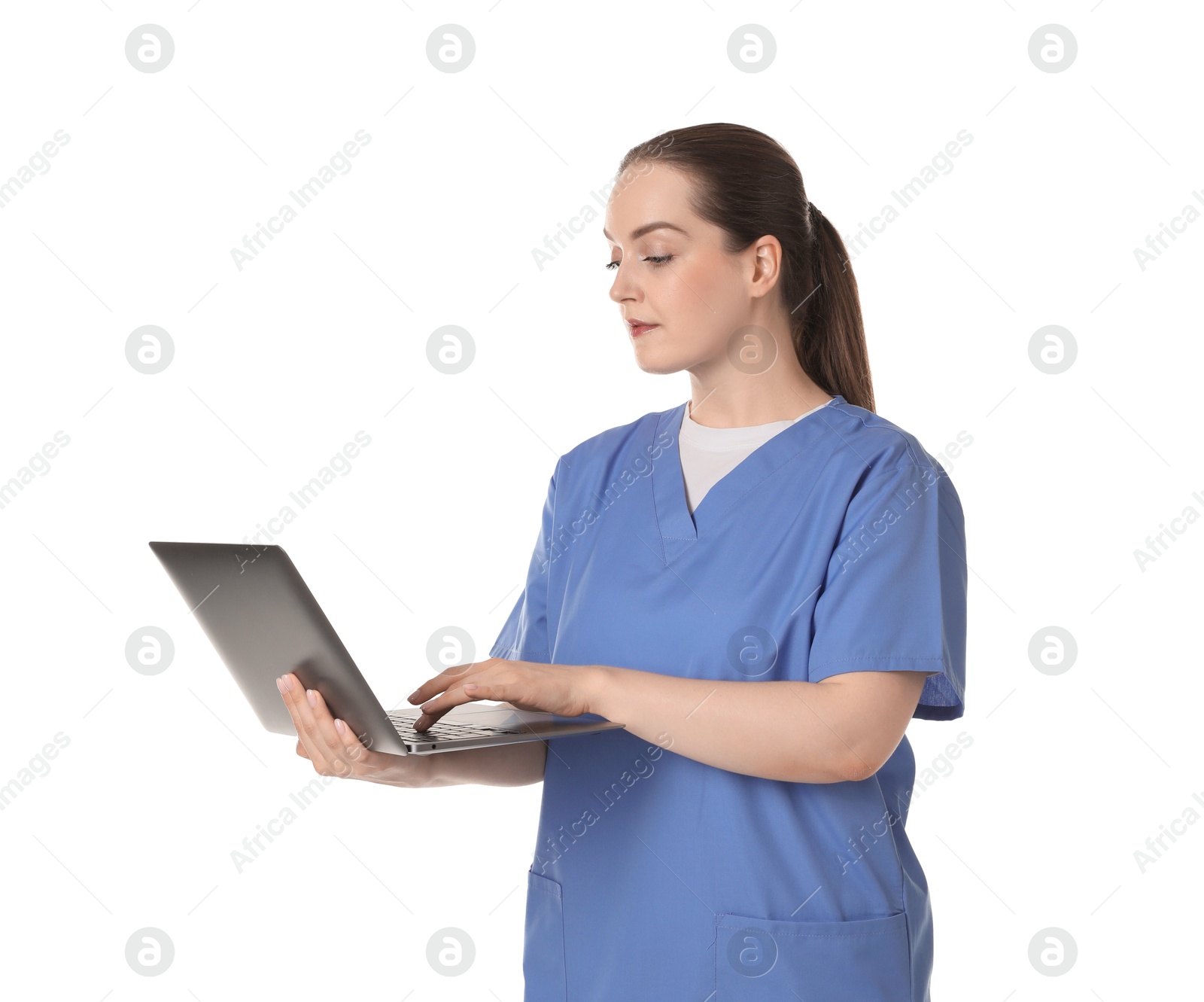 Photo of Professional nurse working with laptop on white background