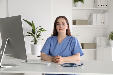 Portrait of nurse at workplace in hospital