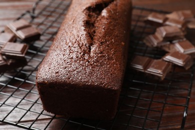 Photo of Tasty chocolate sponge cake on table, closeup