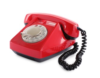 Photo of One red telephone with handset isolated on white