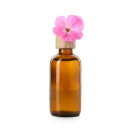 Photo of Geranium essential oil in bottle and beautiful flower isolated on white