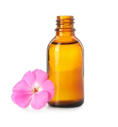 Photo of Geranium essential oil in bottle and beautiful flower isolated on white