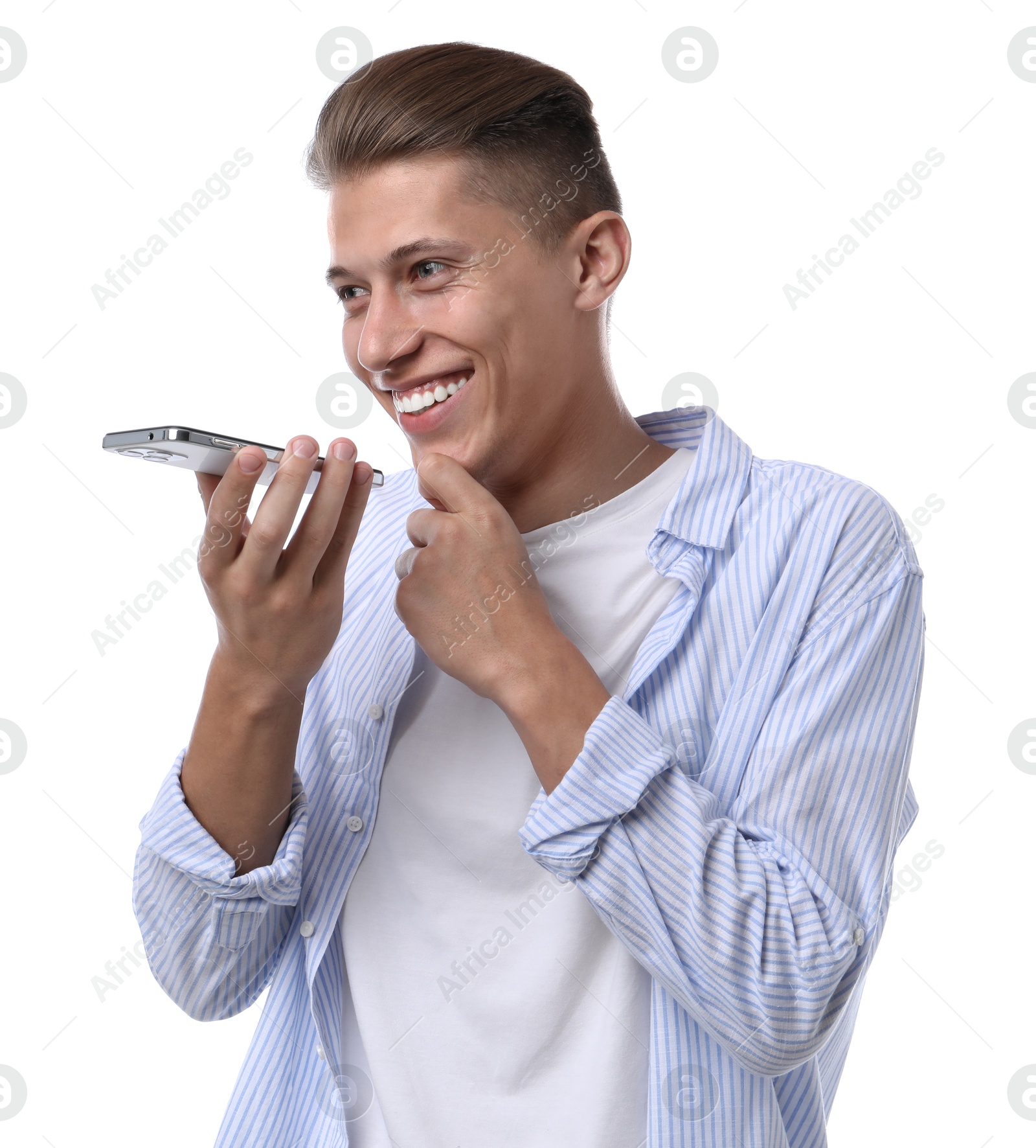 Photo of Young man recording voice message via smartphone on white background