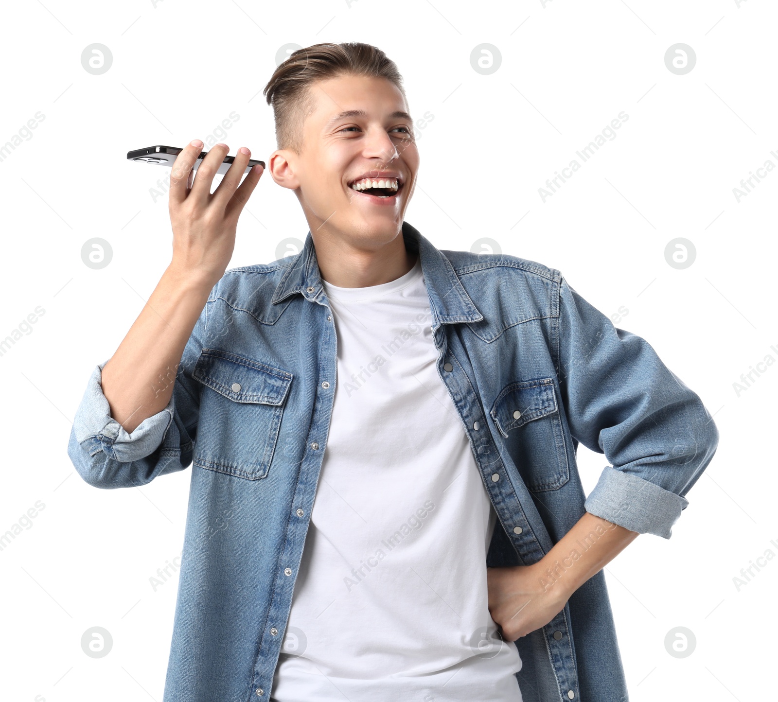 Photo of Young man with smartphone listening to voice message on white background