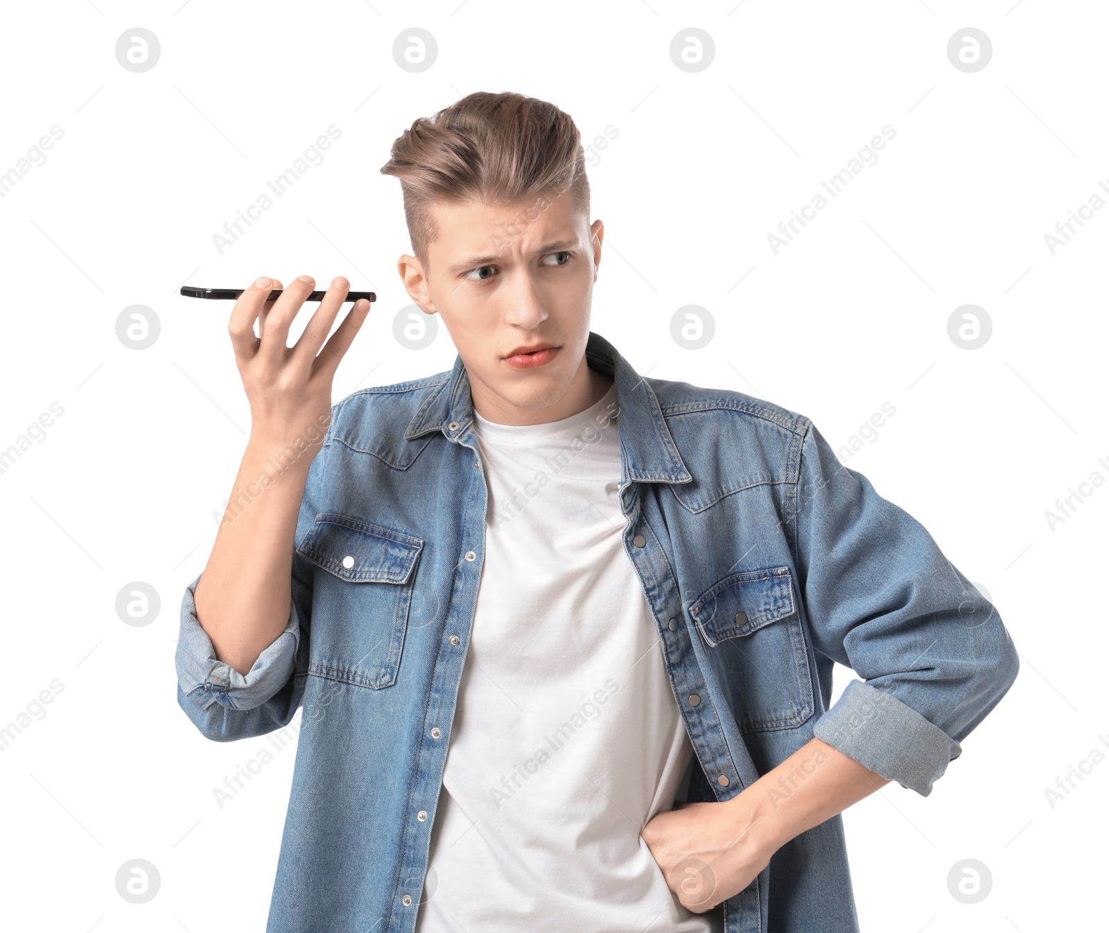 Photo of Young man with smartphone listening to voice message on white background