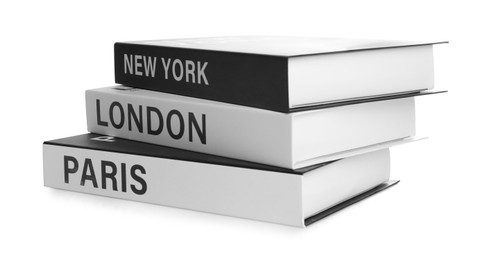 Photo of Stack of hardcover books with different cities names isolated on white