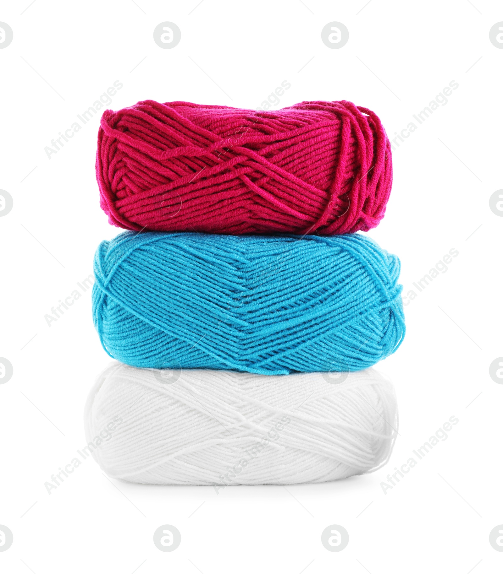 Photo of Stack of different bright yarns isolated on white