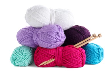 Photo of Many bright yarns and knitting needles isolated on white