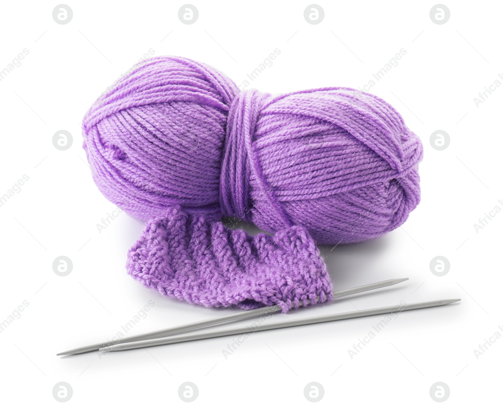 Photo of Skein of violet yarn, knitted fabric and needles isolated on white