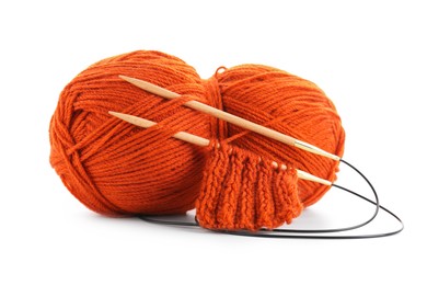 Photo of Skein of orange yarn, knitted fabric and needles isolated on white